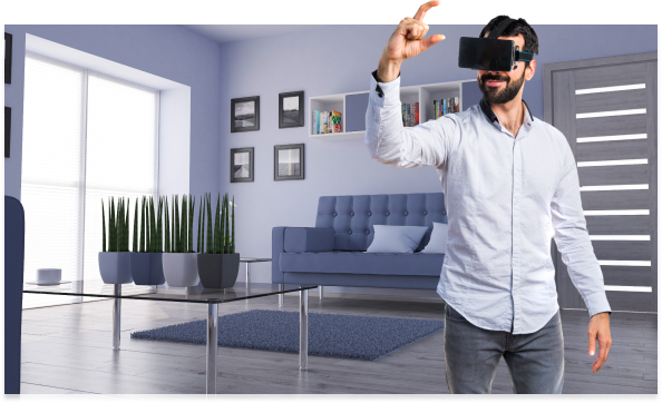 Person using a virtual reality headset in a modern office with coworkers working at desks in the background.